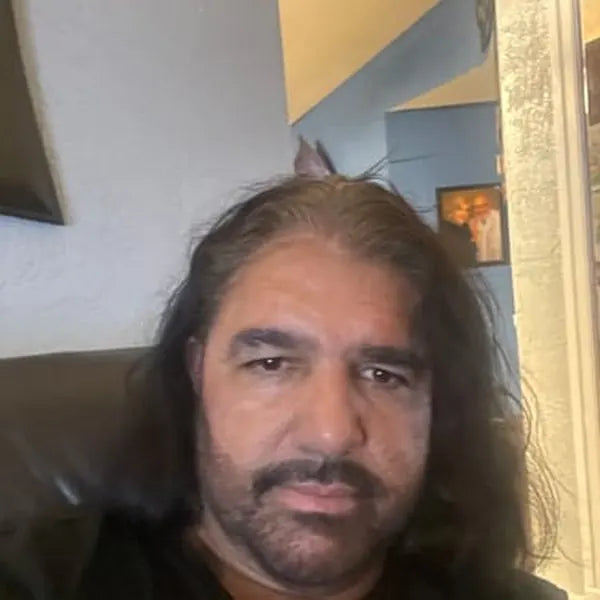 Pedro A. after: dark long hair and dark goatee